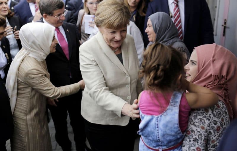 Ангела Меркель с мигрантами