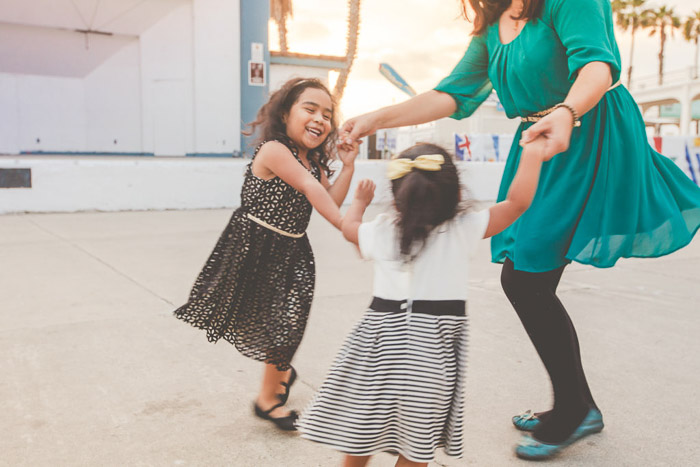 Two children dancing with their mother - kids photography 