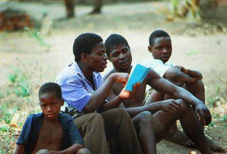 Boys reading together in Malawi, East Africa