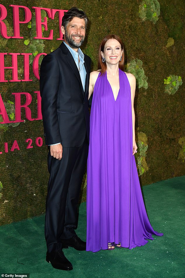 Hot couple: Julianne Moore looked stunning as she arrived at the Green Carpet Fashion Awards at Teatro Alla Scala, Milan on Sunday, accompanied by husband Bart Freundlich