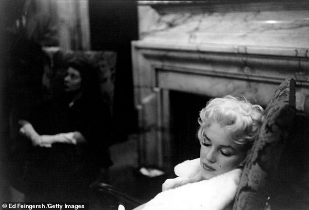 Marilyn takes a nap in   a white fur coat -some of the images have never been seen before
