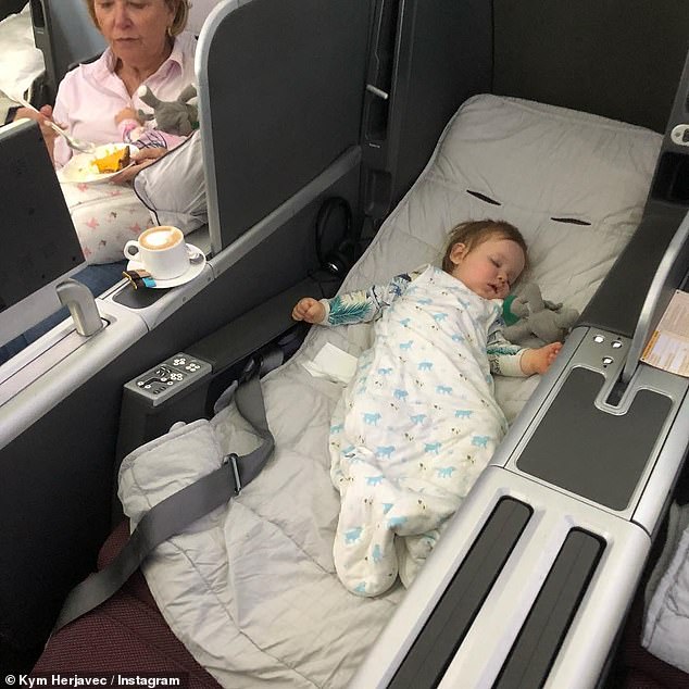 Fast asleep: She also shared an adorable photo of her son Hudson having a sleep during the long-haul flight