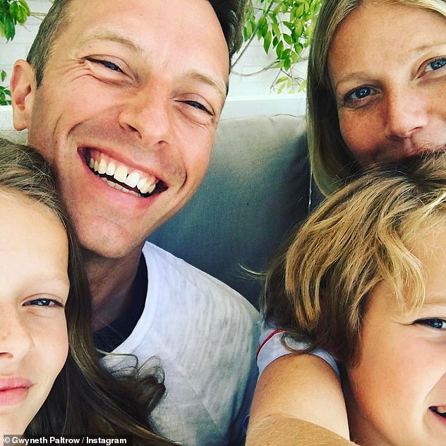 Making it work: Joining them in a celebration of their union on the idyllic getaway was her ex-husband Chris Martin (pictured with their children Apple and Moses)