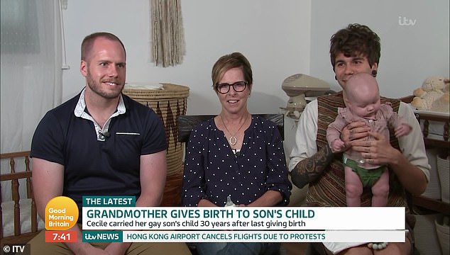 Kind Cecile Eledge, 61, (pictured centre) offered to be a surrogate for her son Matthew, 32, (left) and his husband Elliot Dougherty, 29, (right) and gave birth to baby Uma (right) in March