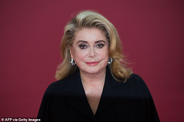 Catherine Deneuve arrives on the red carpet of the 45th Deauville US Film Festival in Deauville, northern France in September
