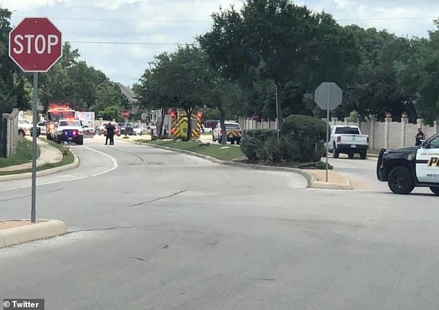 Pictured: The scene in San Antonio, Texas after officers found a family of six, plus two pets, dead in a suspected murder-suicide