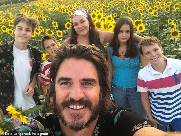 Birthday celebrations: Earlier this month, the radio star celebrated her 55th birthday in the Italian countryside. Pictured with husband Peter Lewis and their four children, Lewis, 17, Sunday, 14, Artie, 12, and Jan, nine