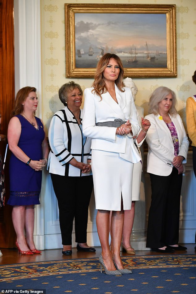 First lady Melania Trump joined President Trump at the celebration; she wore a white suit in honor of the suffragettea