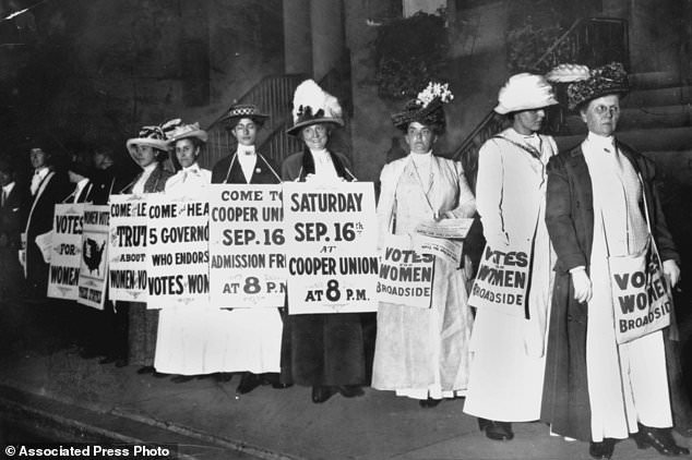 In this September 1916 file photo, demonstrators hold a rally for women