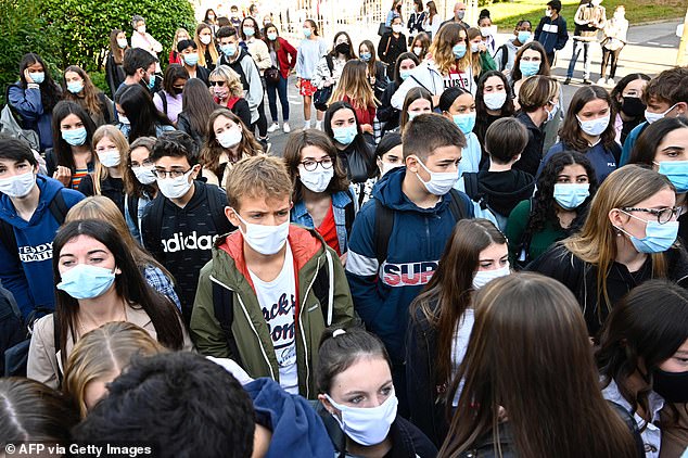 A swathe have studies have found children do not spread the virus as much as feared. Pictured: Children arriving at Brequigny high school in Rennes, western France, today