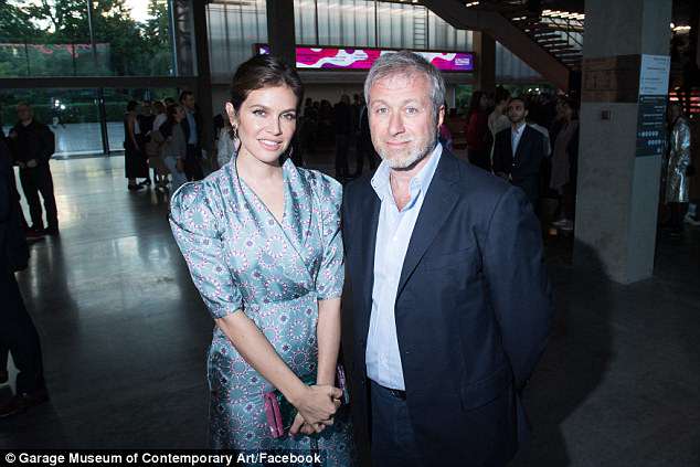 Grin and stare it: Dasha Zhukova and her estranged husband Roman Abramovich were seen together last week in Moscow at a party for Garage Contemporary Art Center (the exes above on Wednesday in Moscow) 