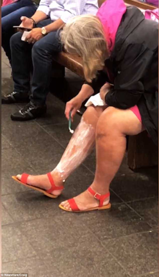 This is the bizarre moment a woman was caught on camera shaving her legs in a New York subway station