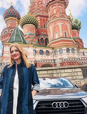 Natalia, pictured in front of the Kremlin, has used her global fame to help promote the World Cup