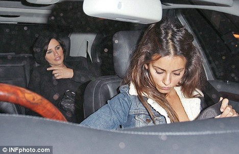 Family affair: Penelope chatted to younger sister Monica in their car, who joined the couple for dinner