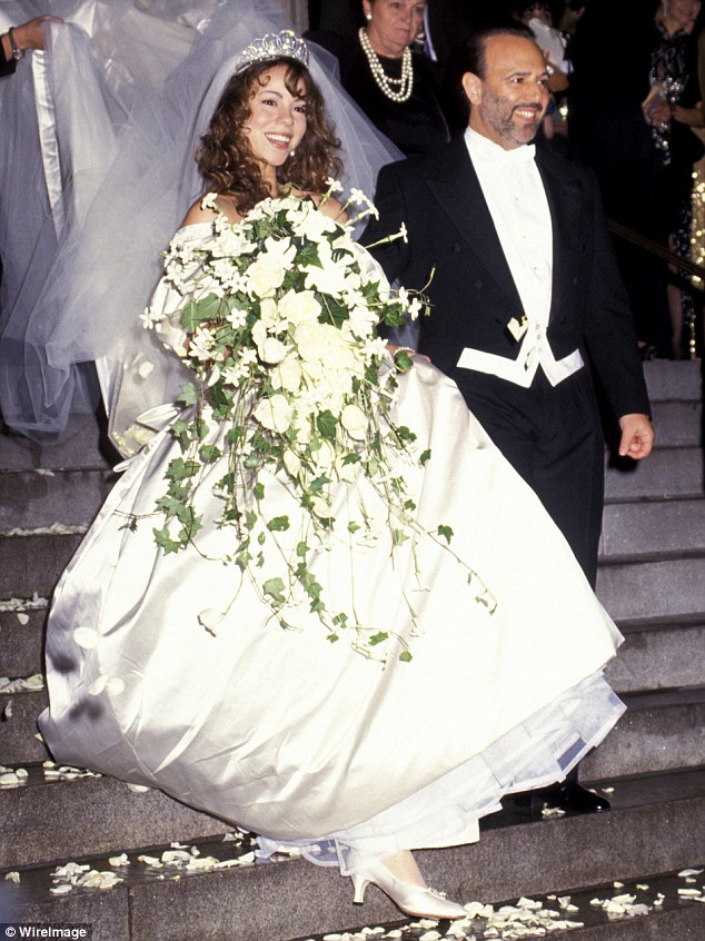 Wedding dress curse? Mariah Carey married Tommy Mottola on June 5, 1993 in a Vera Wang sweetheart gown with a 27-foot train, however they parted ways four years later