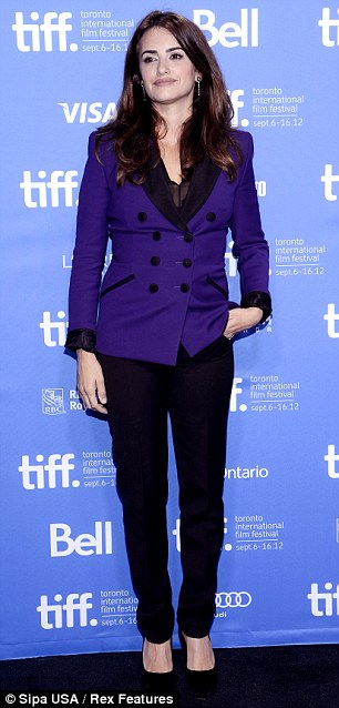 Meet the press: Cruz covered up her curves in an Emilio Pucci double-breasted plum blazer for the press conference earlier today
