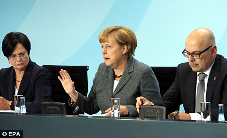 Faith: Angel Merkel (centre) revealed her strong Christian beliefs and said religion was an important part of her life