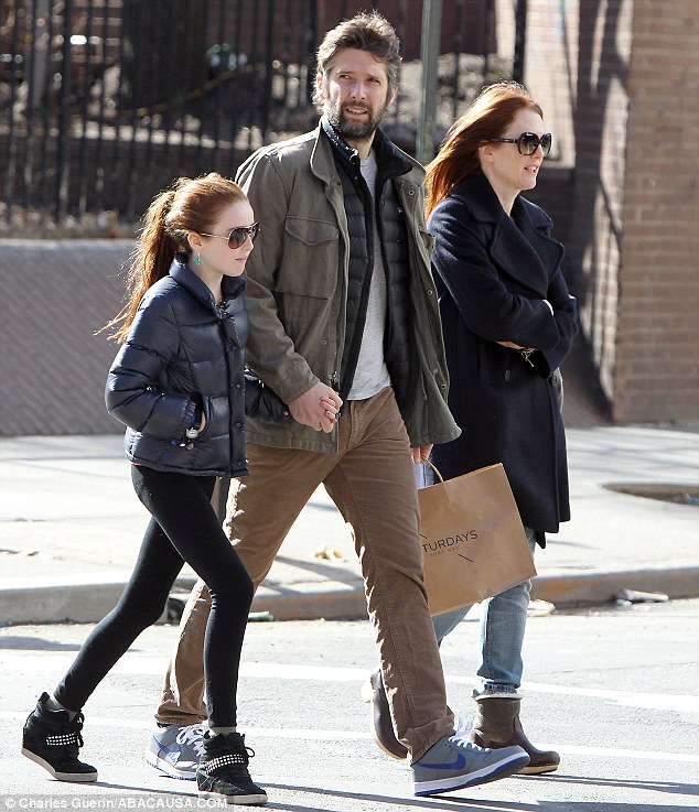 Sunshine in the city: Julianne Moore, 52, and her husband Bart Freundlich, 43, took their 11-year-old daughter Liv out in the New York sunshine on Saturday