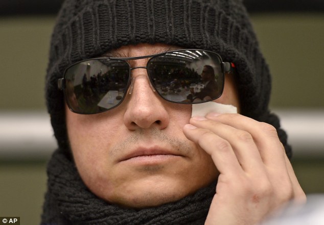 Attacked: Sergei Filin dries his eyes during the press conference at the university hospital in Aachen, Germany, as he speaks about wish to return to the Bolshoi