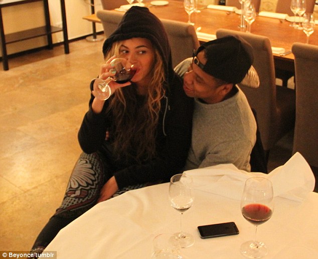 Red, red wine: Beyonce chugged into her no doubt expensive vintage wine as the Jiggaman looked on adoringly