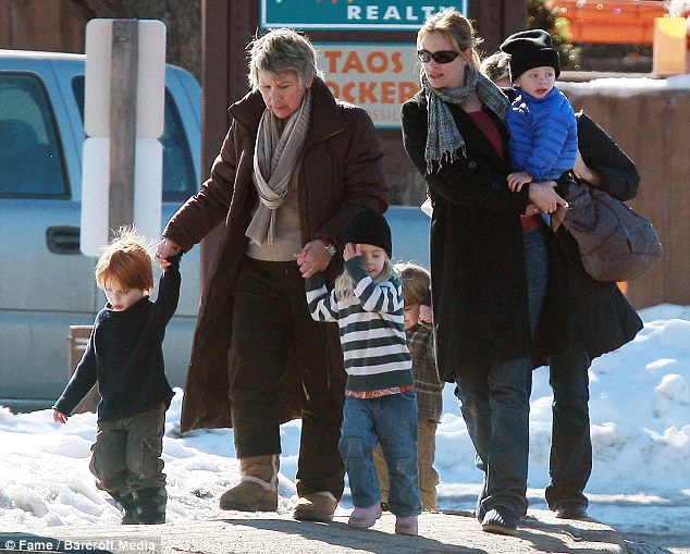 Staying out of the limelight: Julia is seen here in New Mexico with her three children and a family friend in 2009