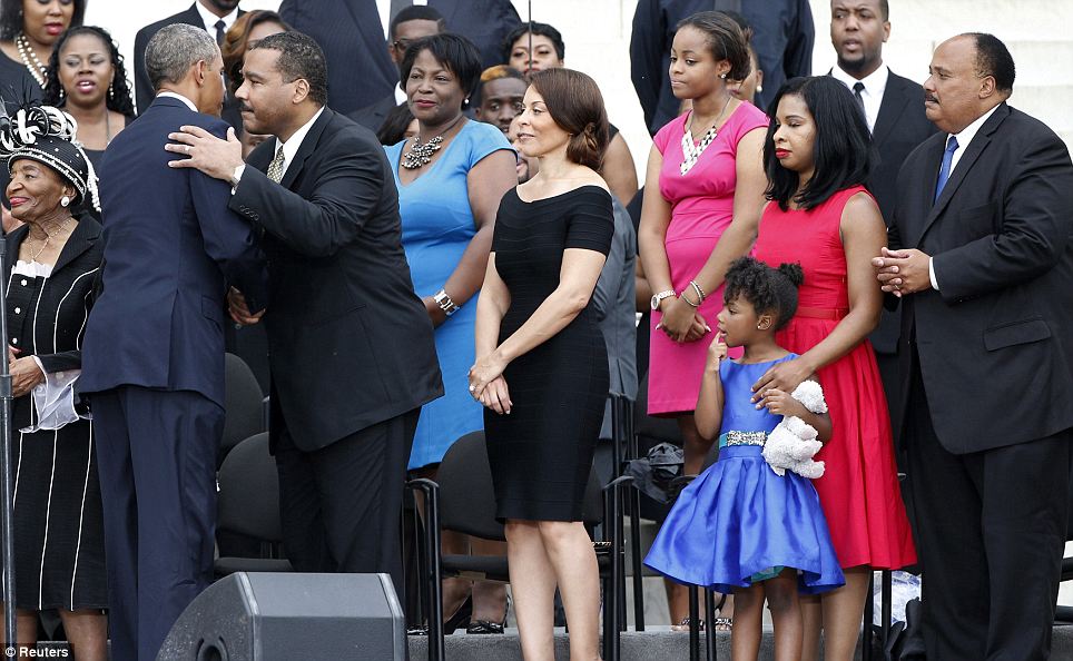 Pretty in blue: Yolanda and her mother Andrea Waters King and dad Martin Luther King III wait to greet President Obama