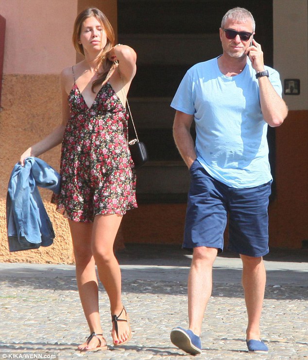 Chatty man: Abramovich seemed to be on his phone for much of the afternoon, but nevertheless looked happy and relaxed as he enjoyed a day out with his stunning partner