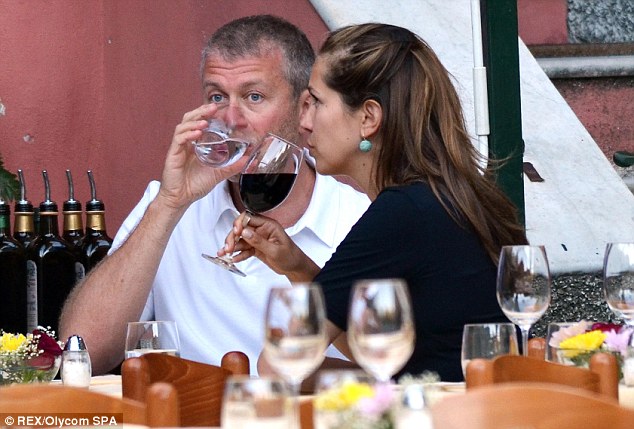 Roman and Dasha enjoy a drink during their visit to Puny restaurant in Portofino