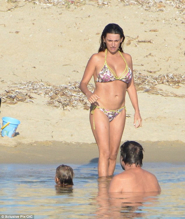 Beach body: Penelope Cruz shows off her post baby figure during a family holiday with her husband Javier Bardem and their children Leonardo and two month old Luna