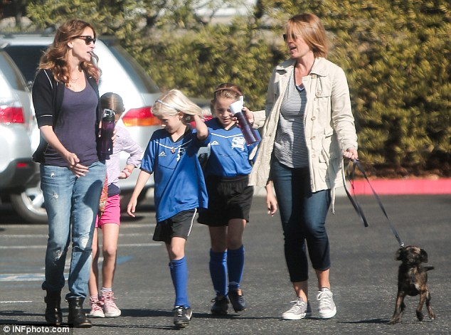 Mama bear: The Hook star in LA on Saturday taking her daughter Hazel, aged eight, to soccer with friends