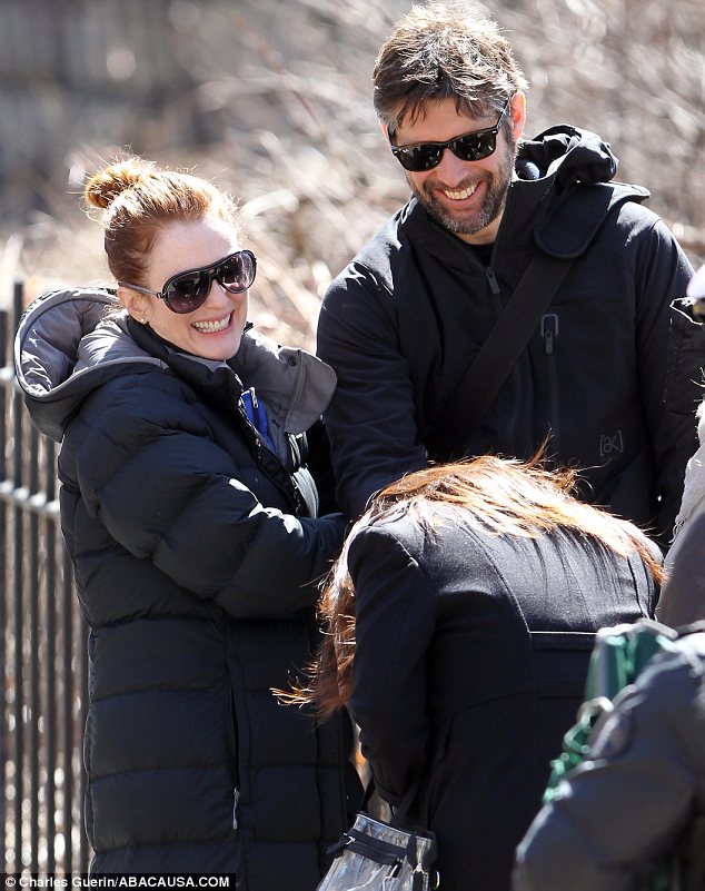 Like newlyweds: The couple shared a joke as they relaxed between takes where Julianne was filming in a New York park