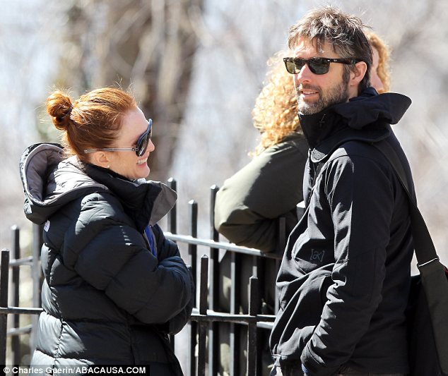 The look of love: The flamed haired beauty gazed adoringly at her hunky husband as she took a break from filming