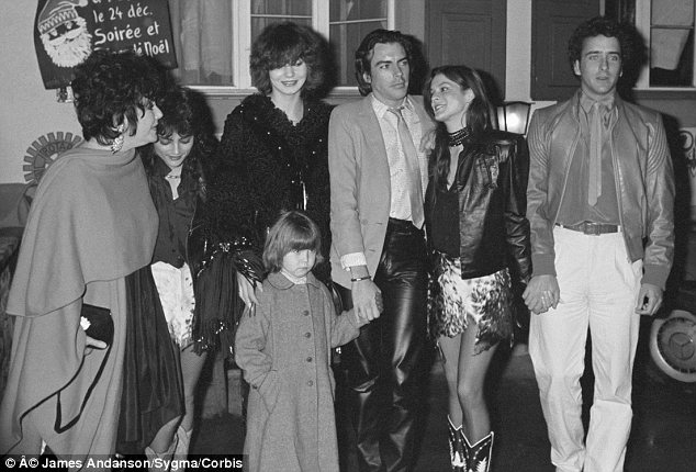 Earlier days: Elizabeth Taylor (left) is seen here on a family trip to Gstaad in 1980 with Naomi (then three years old, center) in tow