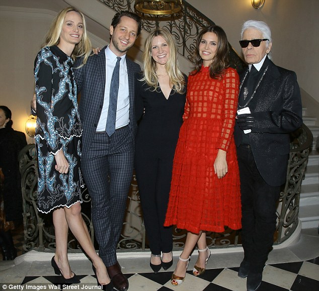 Dasha (second right) poses in Paris this week with Chanel