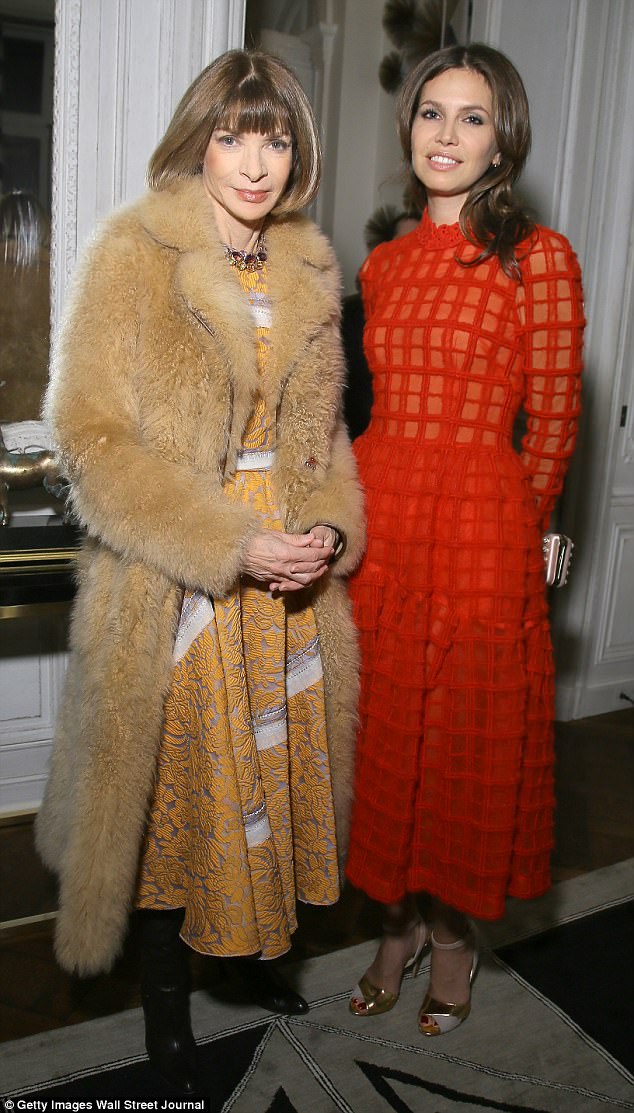 Dasha, right, here with US Vogue editor Anna Wintour, left,  in Paris this week, is big on the fashion scene
