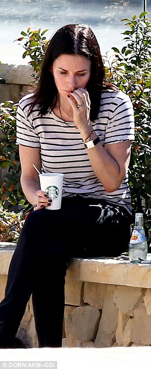 Sad: Courteney was left alone with her thoughts and stared into space as if trying to process some news