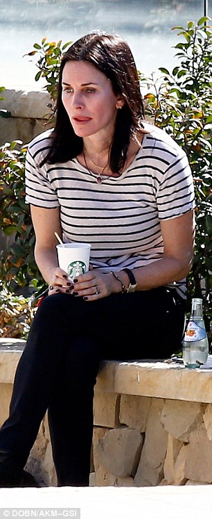 Sad: Courteney was left alone with her thoughts and stared into space as if trying to process some news