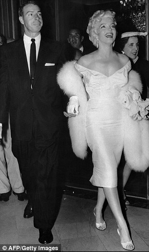 American actress Marilyn Monroe (R) with her husband baseball legend Joe DiMaggio
