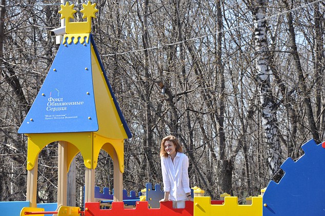 Natalia at a play park in Moscow set up by her Naked Heart Foundation