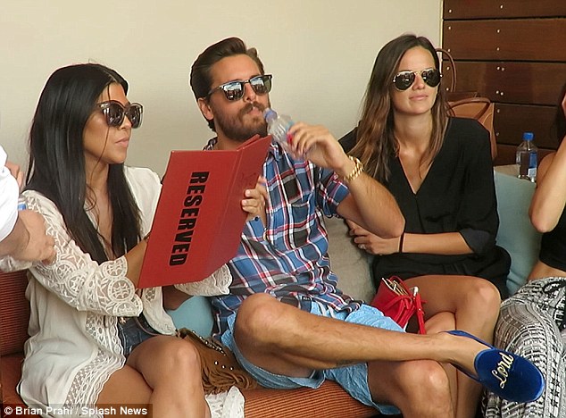 Preppy: Kourtney’s bearded boyfriend wore a red and blue plaid button-up paired with sky blue shorts and suede Lord Disick slippers