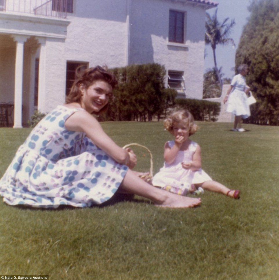 Style icon: This never-before-seen photo of Jacqueline Kennedy sitting with her daughter Caroline is one of the 79 images that are up for auction this week