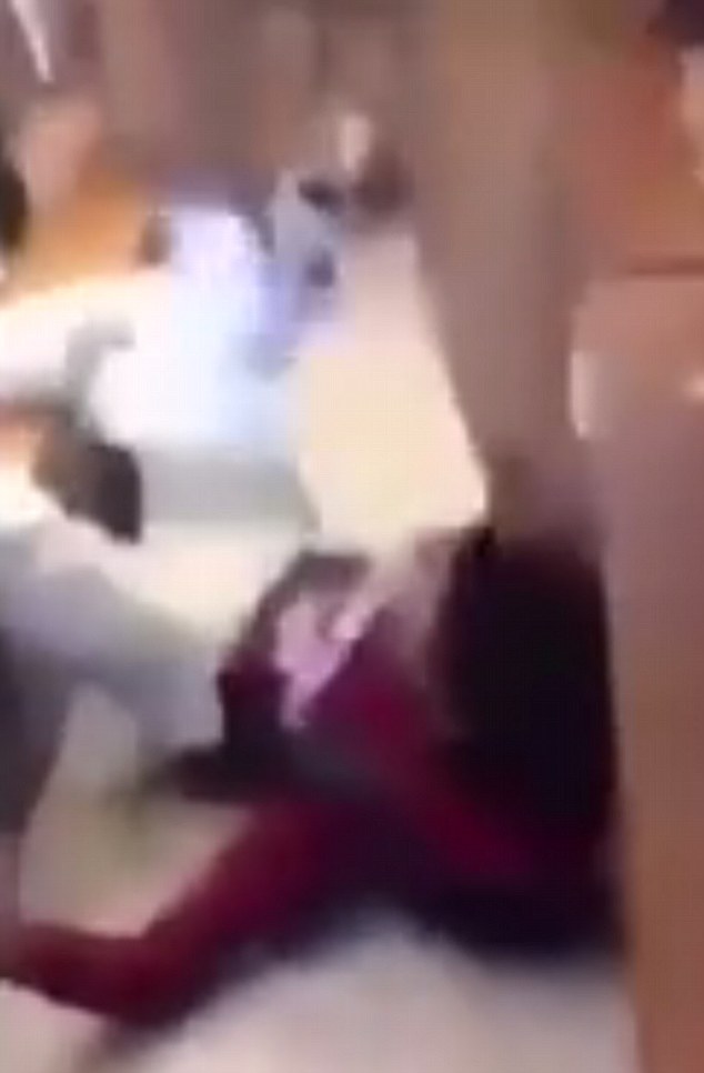 Pummeled: The aggressor can be seen in the confronting 30-second footage repeatedly punching the other student in the face before brutally stomping on his head (pictured)
