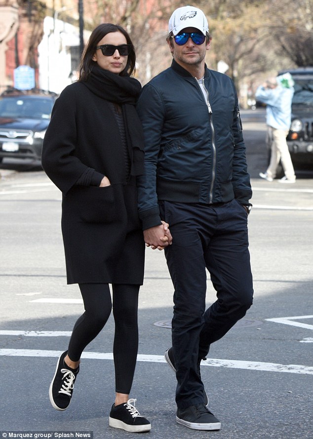 Darker look: The Russian stunner was spotted out in New York with her boyfriend, actor Bradley Cooper on Wednesday, just days before the dramatic transformation