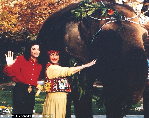 An unusual gift! Liz gave Michael an elephant called Gypsy, adding to the growing menagerie at the Neverland ranch in California, according to this photo - one of a set from an auction. Their intense friendship was characterized with extravagant presents and childlike hobbies