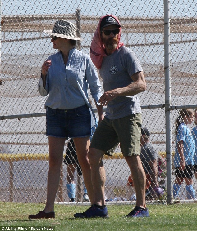 Dressed for the heat: The Oscar winning actress and her husband of 14 years, Danny Moder, stayed cool on the sidelines while their children played