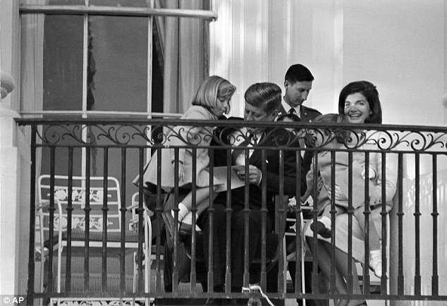 Happier days: Jackie had these conversations with Reverend Richard T. McSorley, who she met with at the request of her brother-in-law Bobby Kennedy (John and Jackie with their children on November 12, 1963 at the White House)