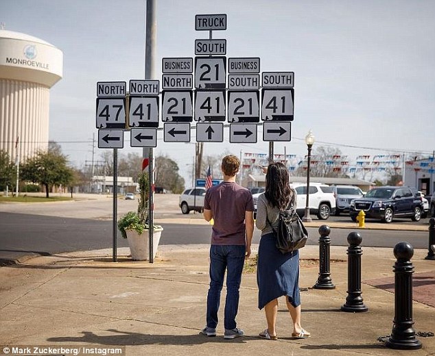 Signs: Zuckerberg posted a photo on Tuesday as he and Chan left Alabama to head to Mississippi