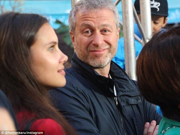 Putting on a brave face: Roman Abramovich smiles for the camera at a social event in St Petersburg last week