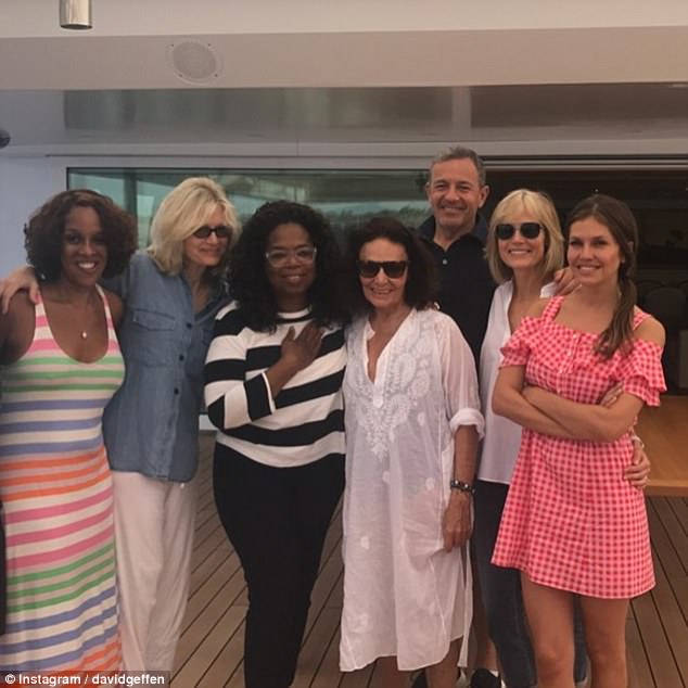 A smiley-looking Dasha (pictured, far right) spent last week without her husband on David Geffen