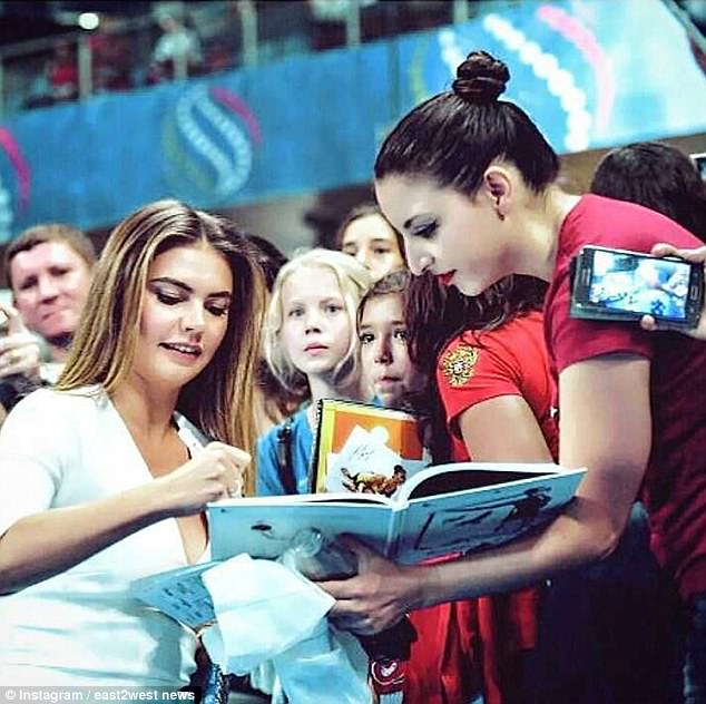 Kabaeva signing autographs for fans. Her role is seen as a step back for Russian sport which has been hit by a succession of doping allegations leading to major competitors being banned from international events including the Olympics.